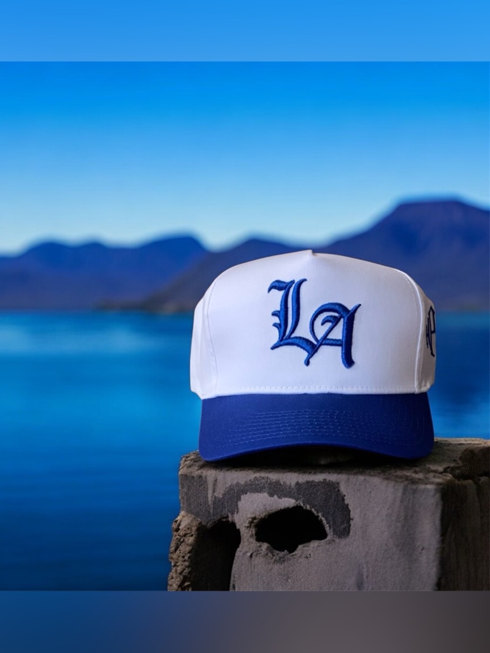 White and Blue LA Trucker Hat